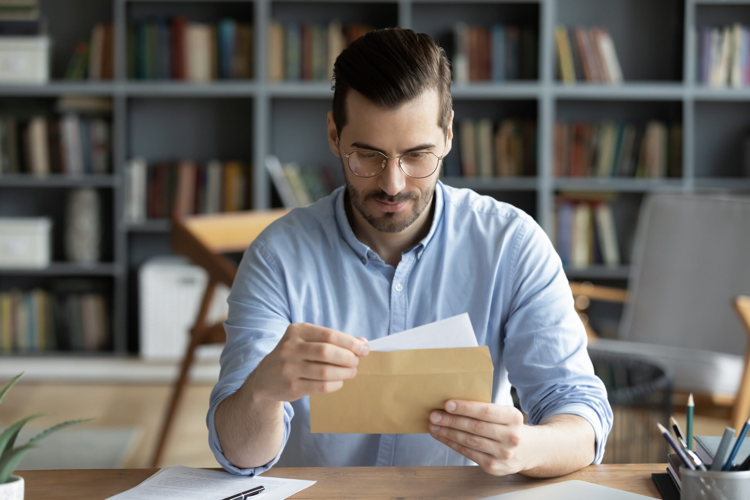 A parent looking over school tuition statements