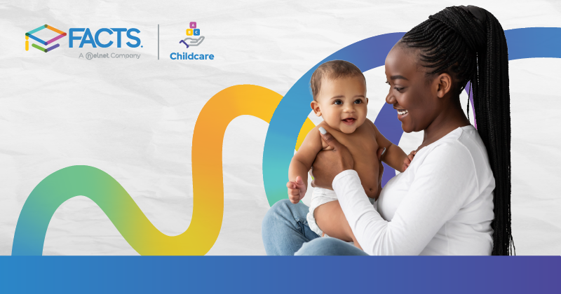 Daycare teacher holding a baby.