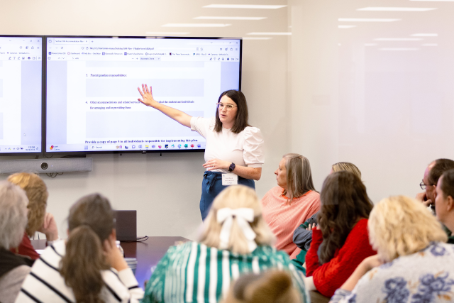 A speaker giving a presentation