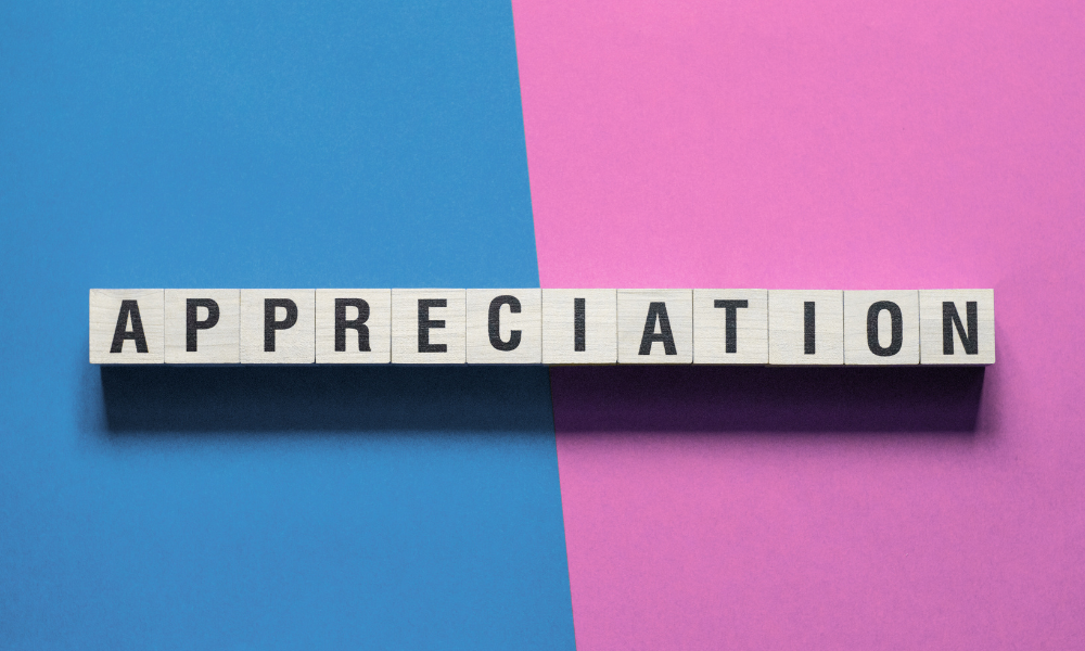 blue and purple background with tiles spelling out the word appreciation