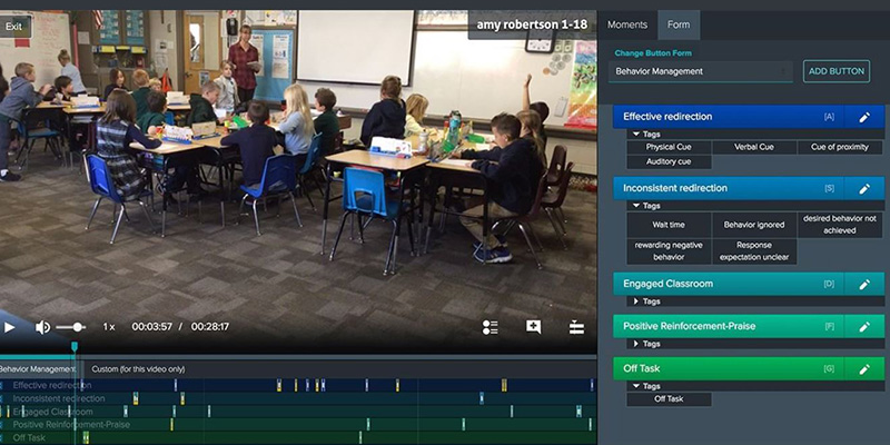Teacher in classroom with students being recorded on her lessons.