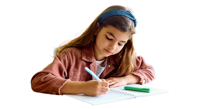 A young student writing in a notebook