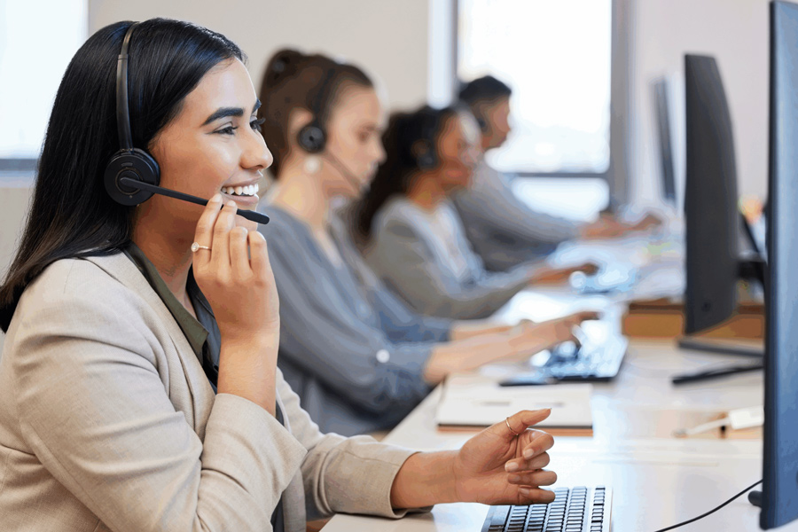 four people working at a call center