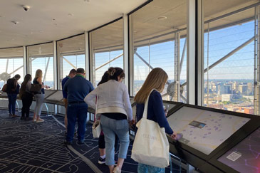 Elevate 2022 attendees viewing the Dallas skyline from inside Reunion Tower