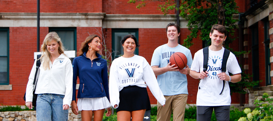 College students wearing school branded apparel