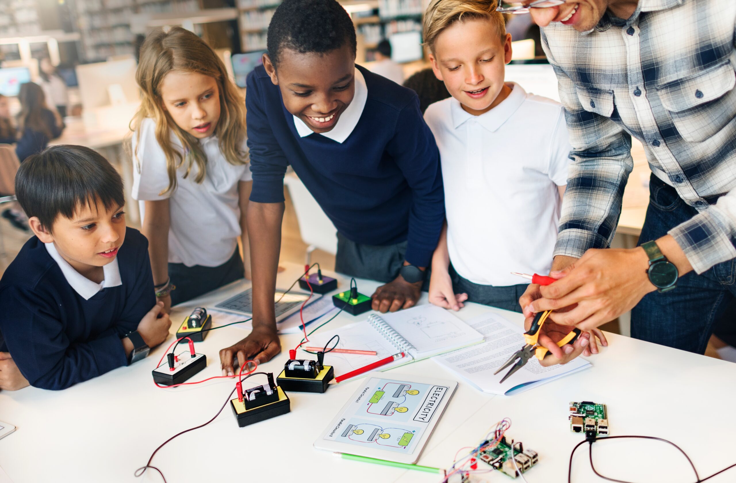 Elementary students working on a science and technology project