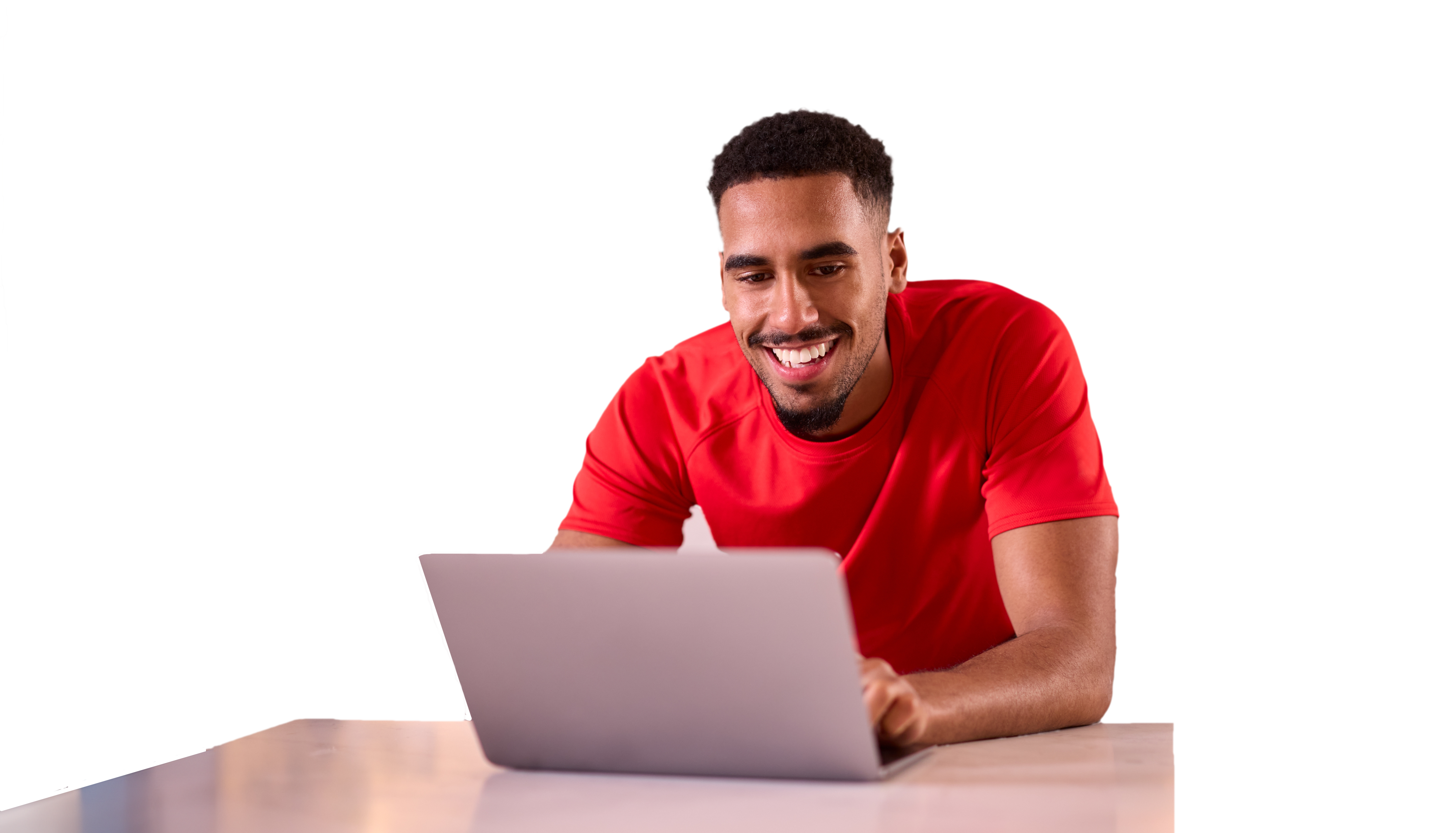 Young student in a red shirt using a laptop computer