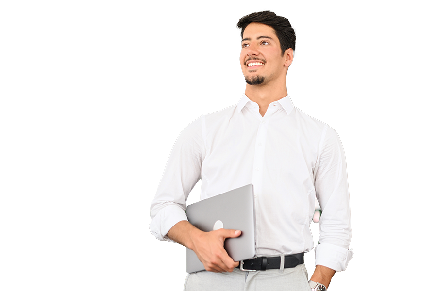 Person in a white shirt holding a laptop computer